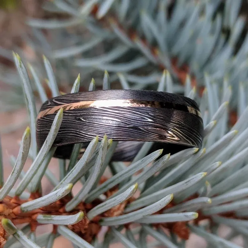 A Touch of Luxury: Authentic Damascus Steel Wedding Band with 14k Rose Gold Inlay