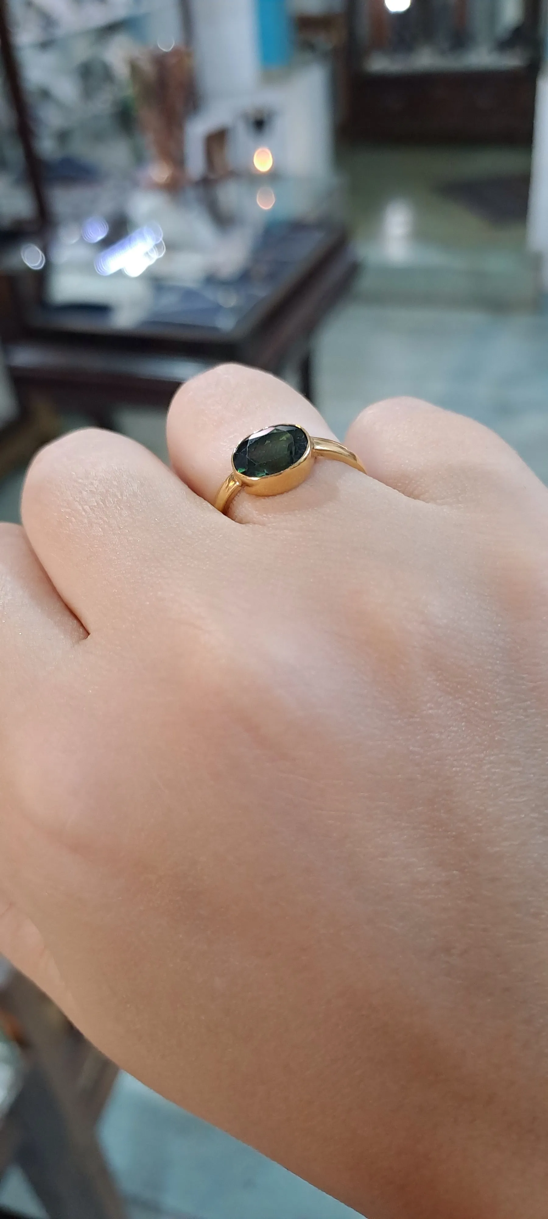 Ring in 14k gold with a green tourmaline